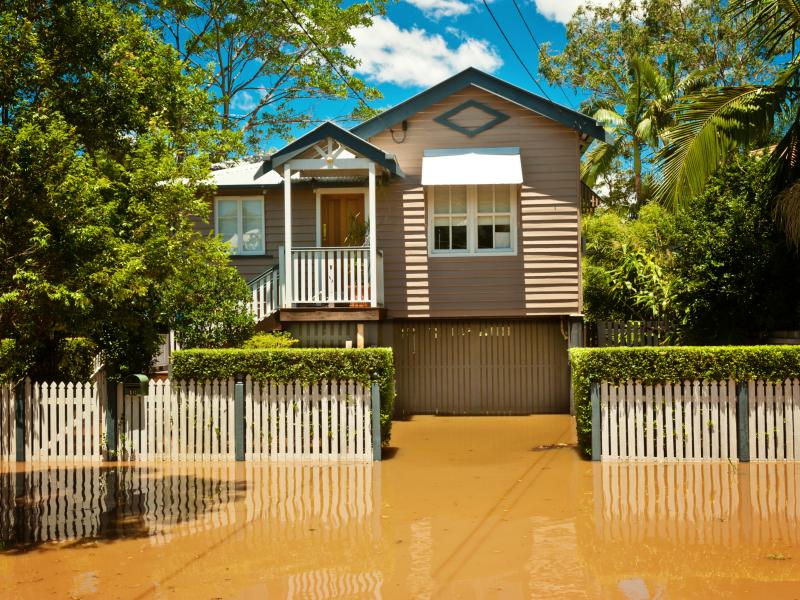 Queenslander house surrounded by flood water