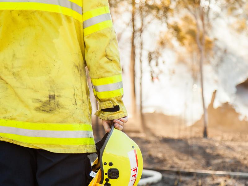 Fire crew looking at burnt area